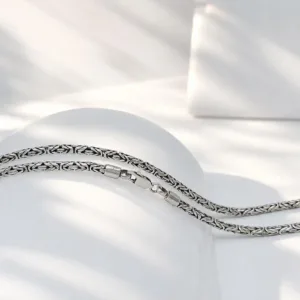 Close-up macro detail of woven Byzantine sterling silver chain