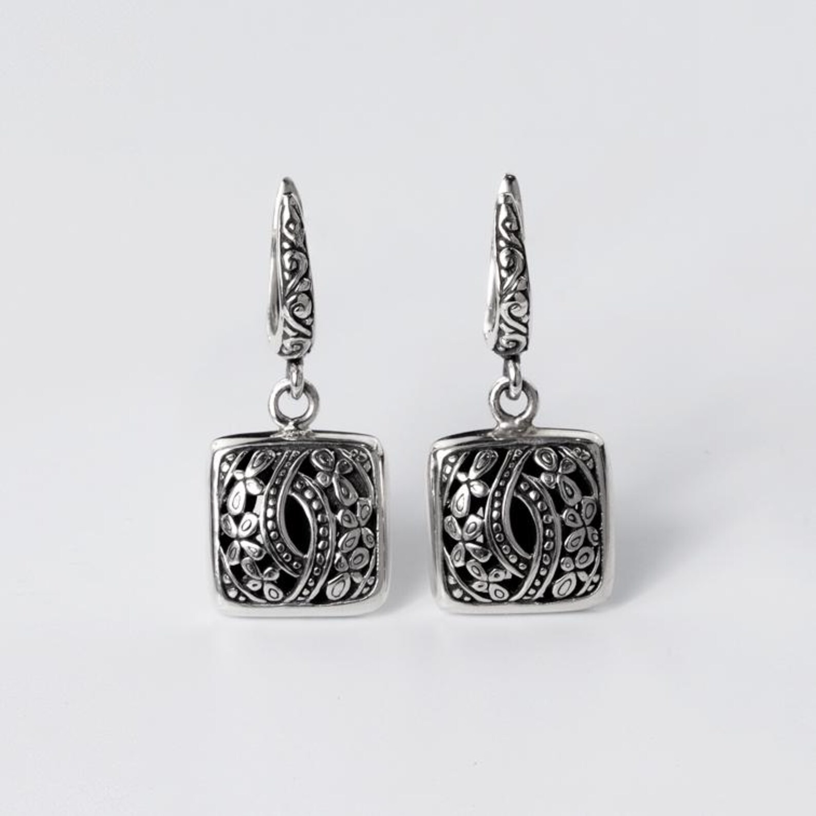 Lightweight Sterling Silver Earrings Handmade handmade Bali sterling silver earrings floral engraved detail artisan jewelry close up