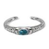 detailed silver scrollwork and turquoise gemstone on Balinese cuff bracelet