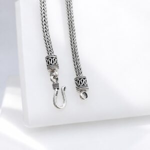 Polished 925 sterling silver woven chain detailed close up