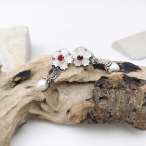close up of Balinese floral sterling silver earrings