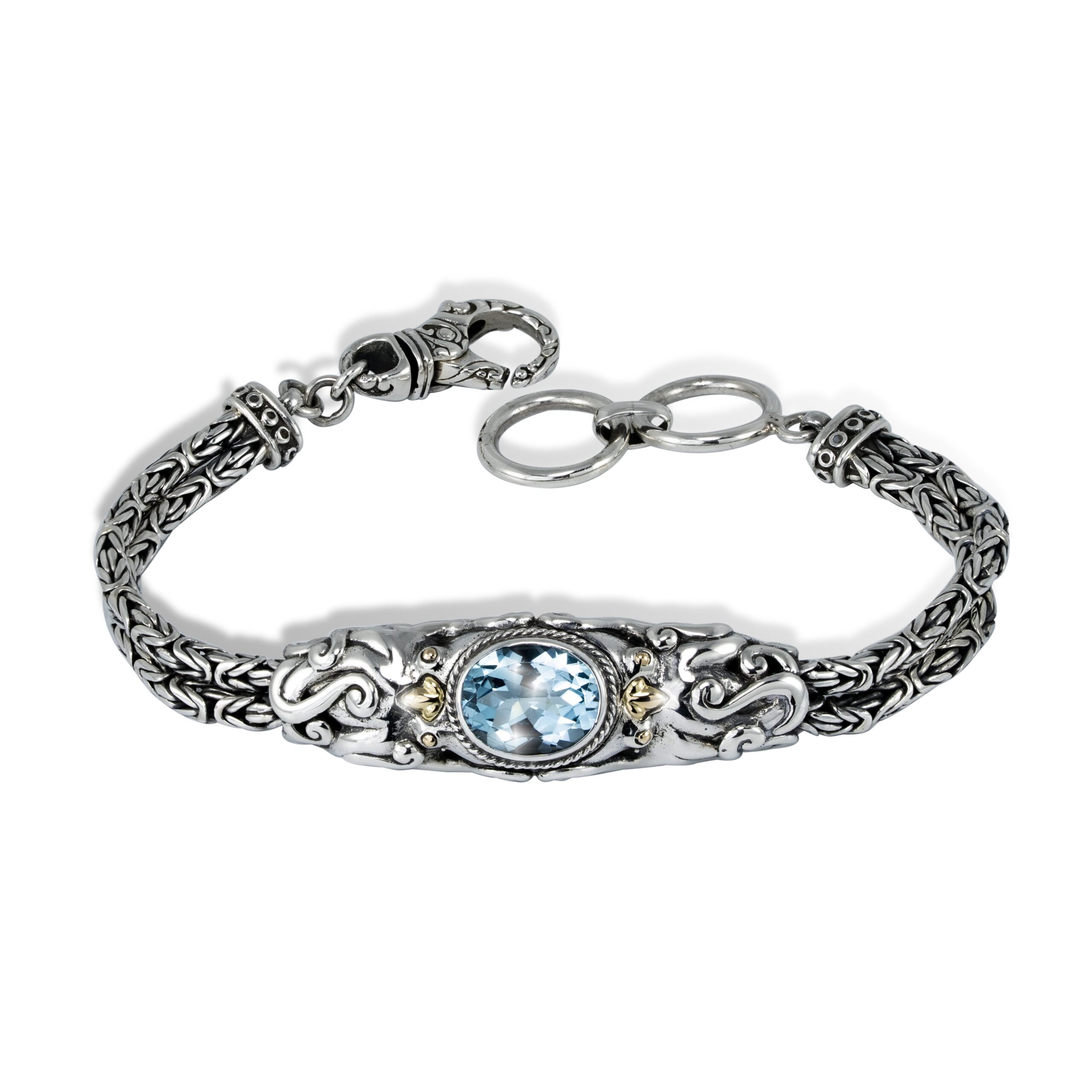 Faceted Blue Topaz Octopus Sterling Silver Bracelet faceted blue topaz gemstone surrounded by sculpted silver octopus design