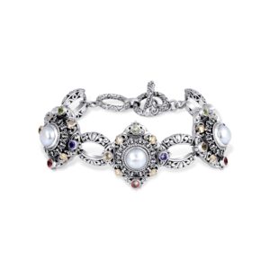 Handcrafted 925 sterling silver link bracelet with ornate filigree panels inspired by Balinese temple art