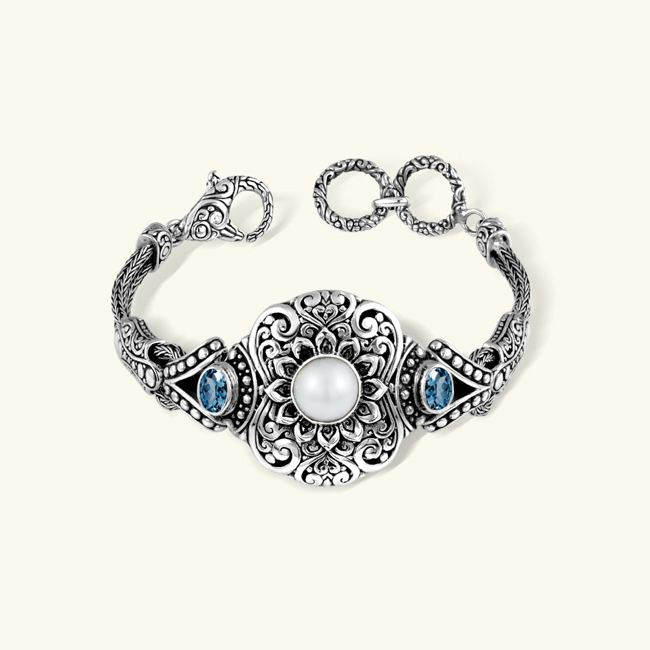 925 Sterling Silver Pearl Bracelet with Blue Topaz Accents 925 sterling silver pearl bracelet with blue topaz accents