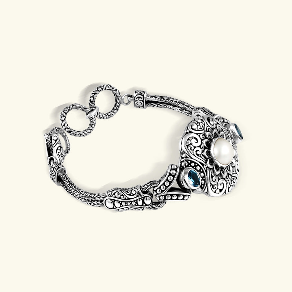 Bali Sterling Silver Floral Bracelet with Pearl and Blue Topaz Bali sterling silver floral bracelet with luminous pearl