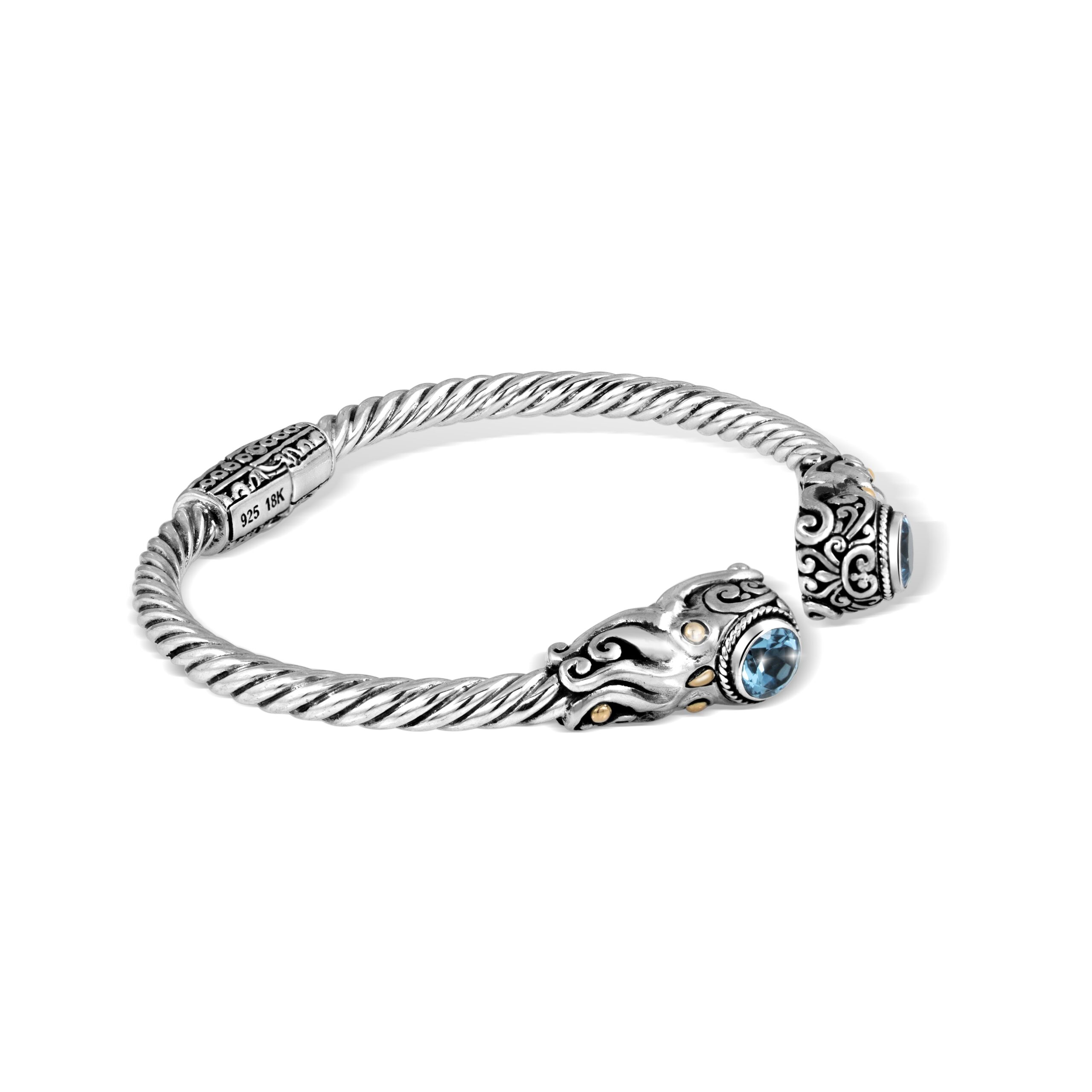 Swiss Blue Topaz and Gold-Plated Octopus Bracelet Close-up of an Indonesian sterling silver octopus cuff bracelet with 18K gold-plated accents and blue topaz