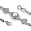 detailed Balinese silver bracelet with scrollwork and pearl centerpiece