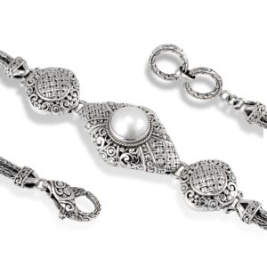 detailed Balinese silver bracelet with scrollwork and pearl centerpiece